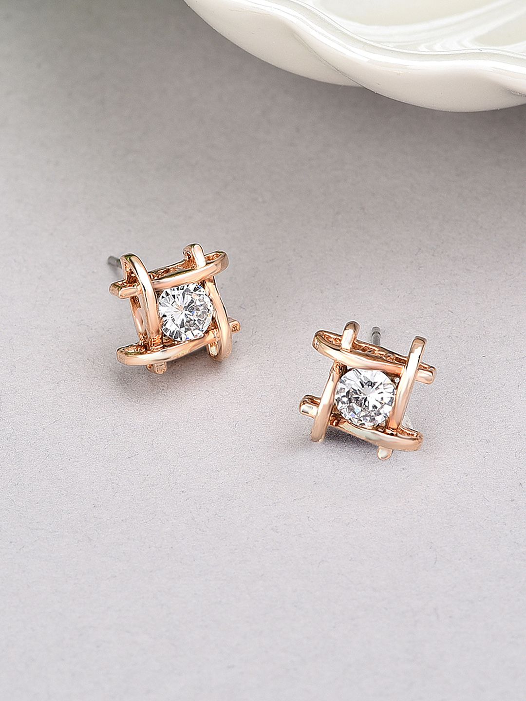 AMI Rose Gold-Toned & Cubic Zirconia Studs Earrings Price in India