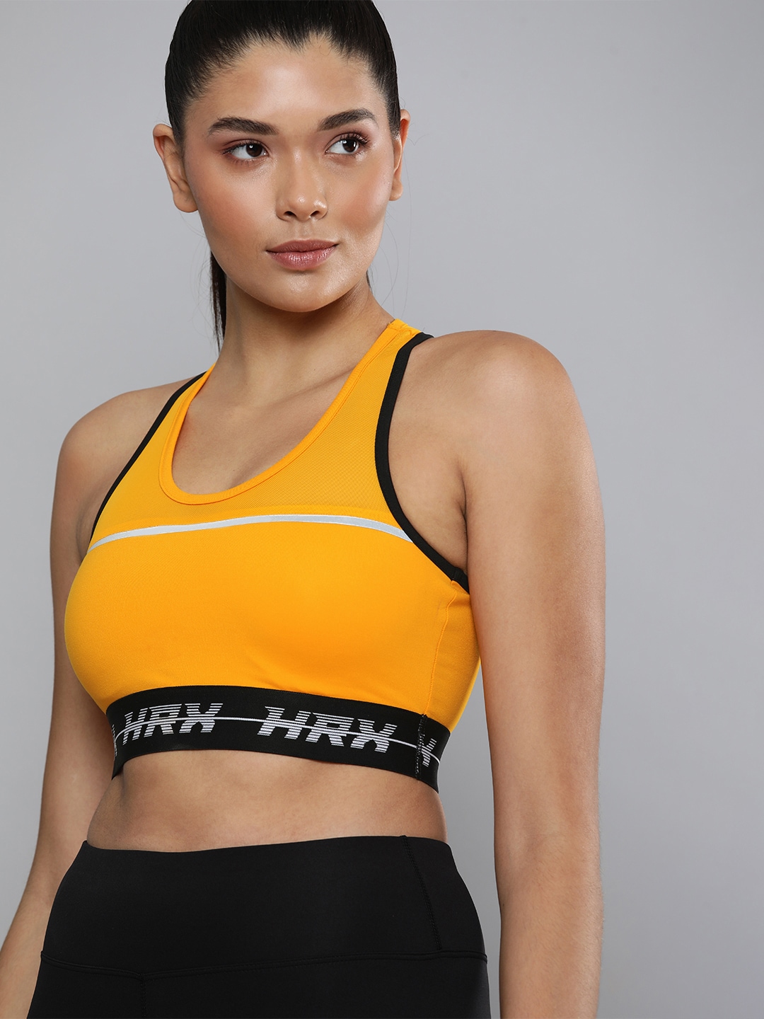 HRX By Hrithik Roshan Running Women Orange Rapid-Dry Solid Sports Bra Price in India