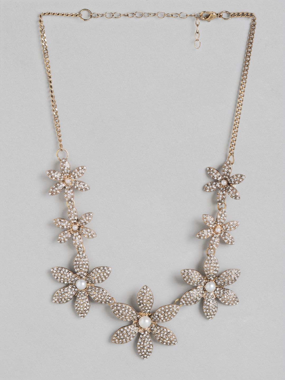 DressBerry Gold-Toned Stone-Studded Floral Antique Statement Necklace Price in India