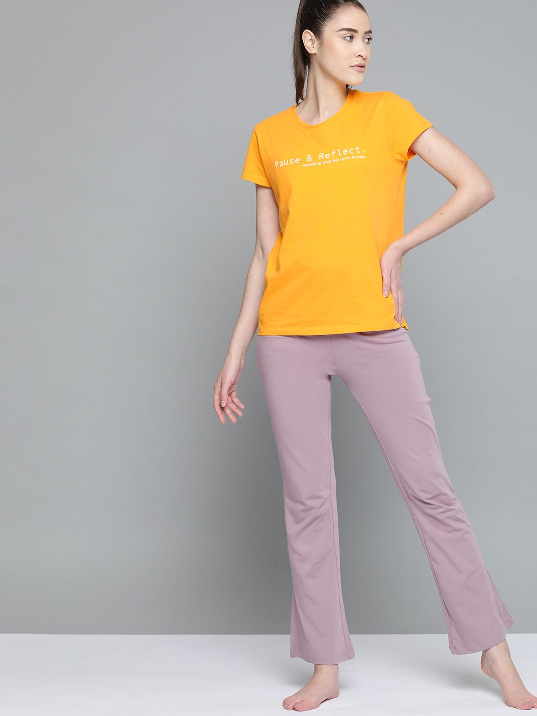 HRX By Hrithik Roshan Yoga Women Saffron Solid  Sustainable T-shirt Price in India