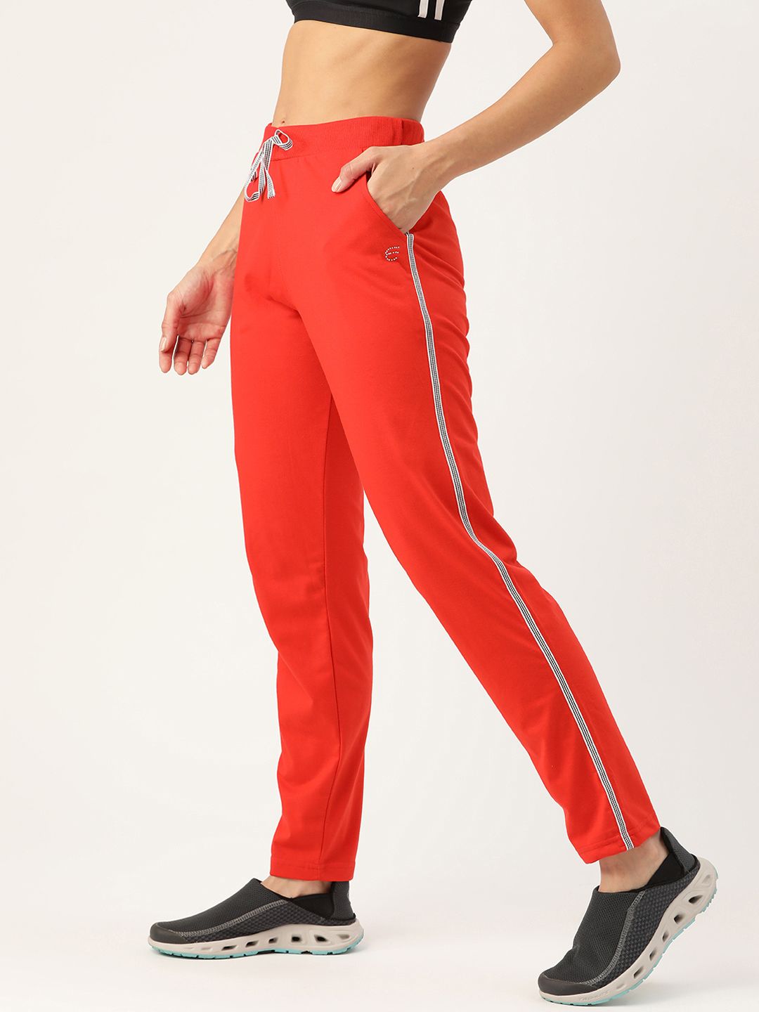 FEMEA Women Coral Red Solid Side Tape Knit Cotton Rich Straight-Fit Track Pants Price in India