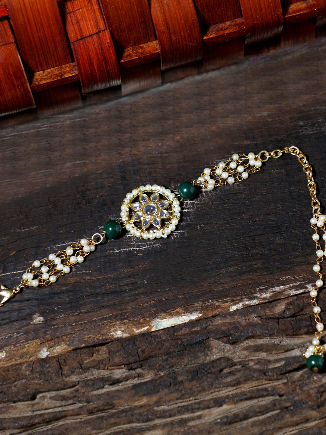 KARATCART Women Gold-Toned & White Kundan Handcrafted Gold-Plated Wraparound Bracelet Price in India