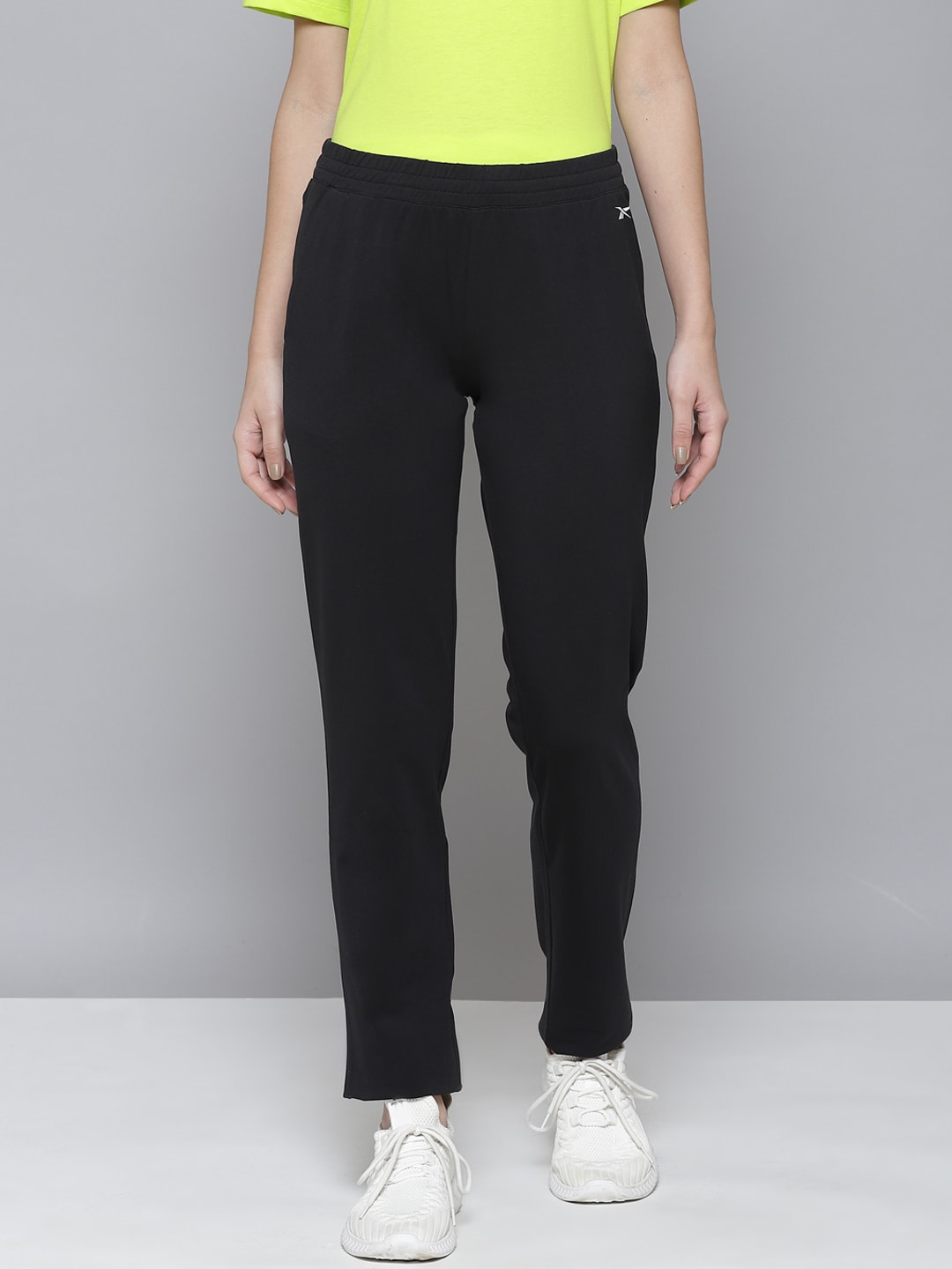 Reebok Women Black Foundation Solid Training Track Pants Price in India