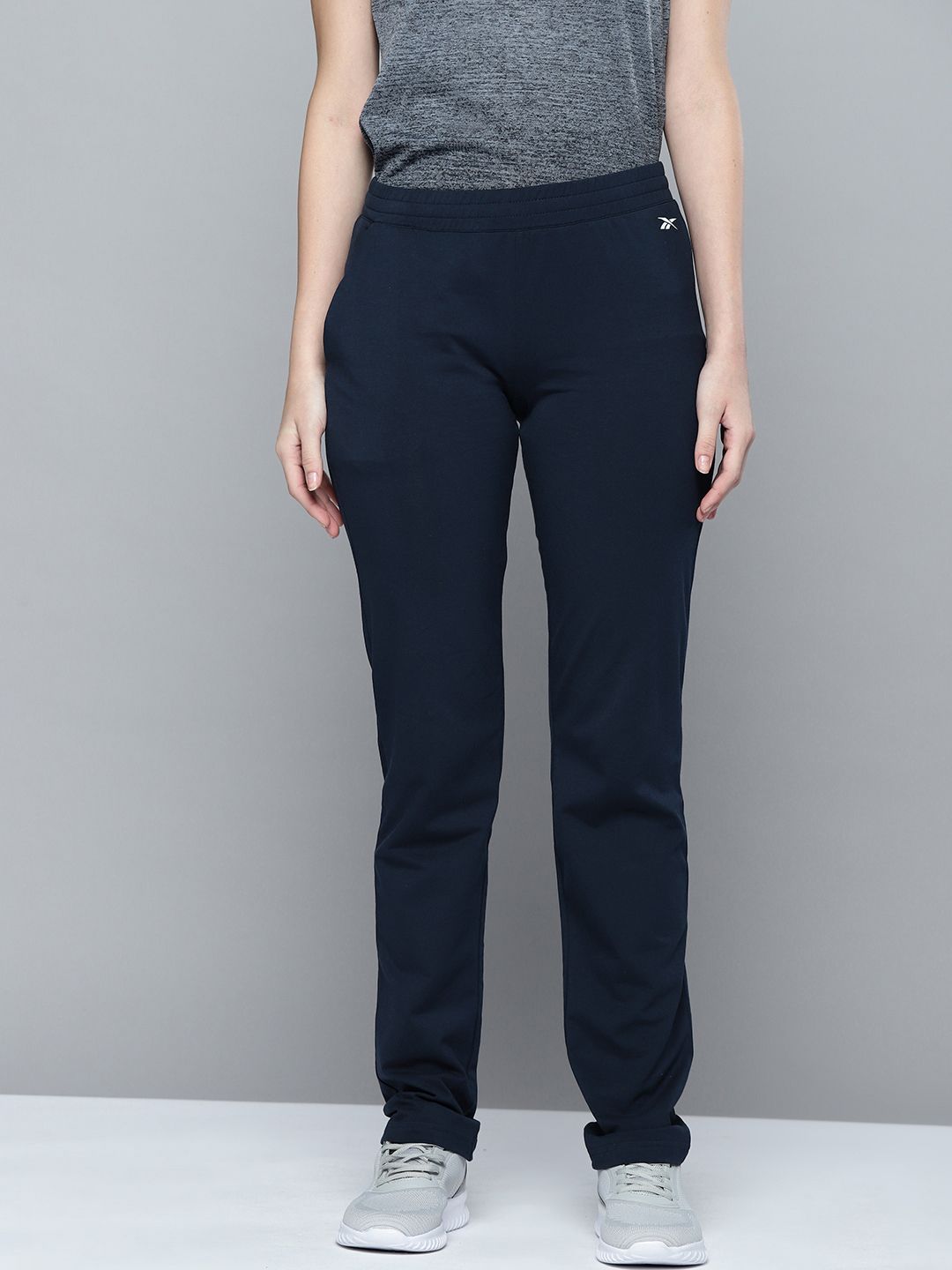 Reebok Women Navy Blue Solid Training FND Track Pants Price in India