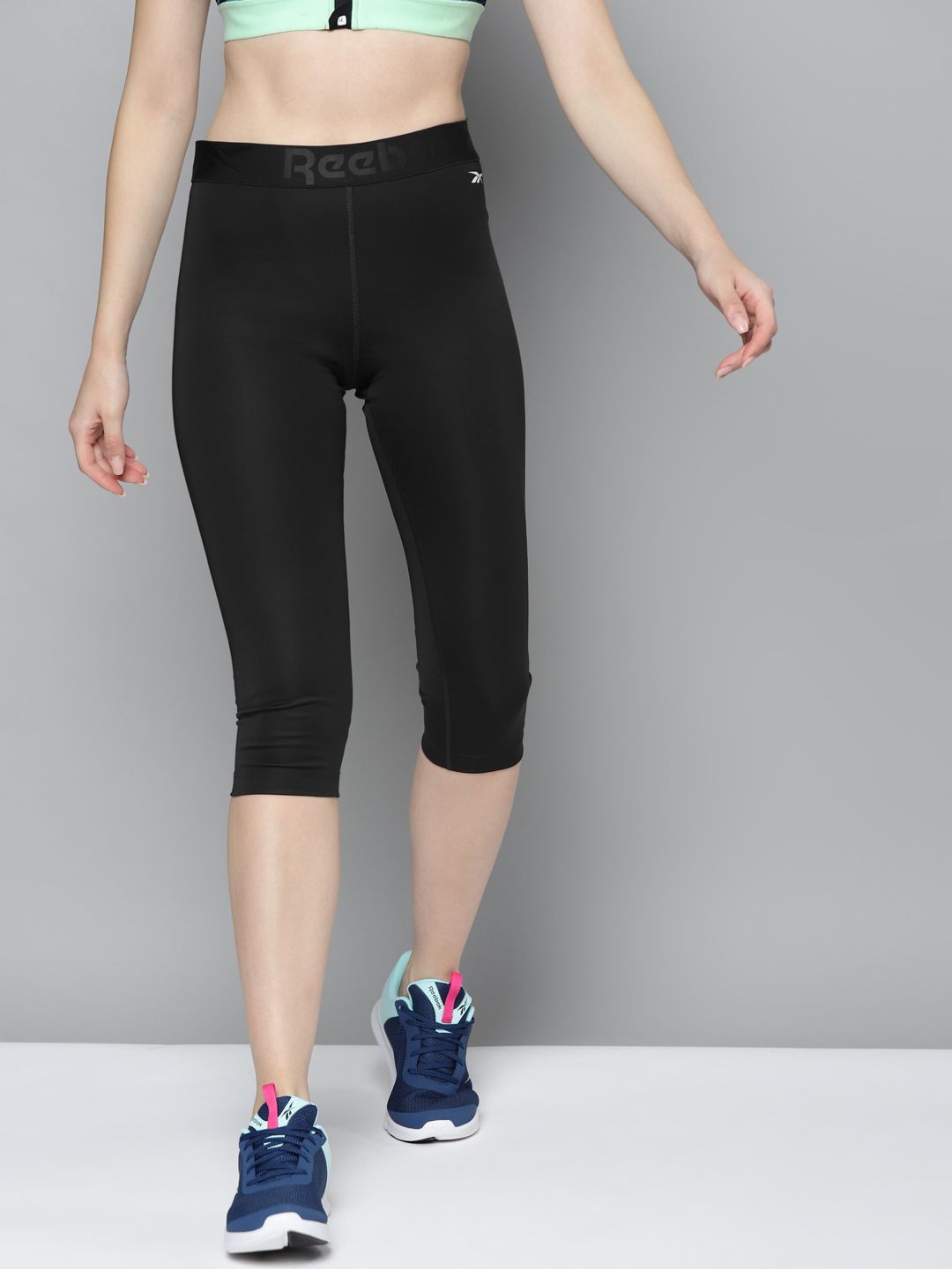 Reebok Women Black Solid 3/4th WOR COMM Capri Training Tights Price in India