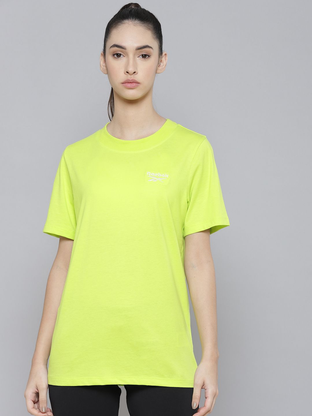 Reebok Women Fluorescent Green Solid Training T-shirt Price in India