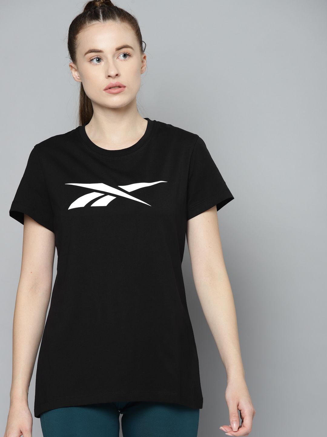 Reebok Women Black & White Brand Logo Printed Training or Gym T-shirt Price in India
