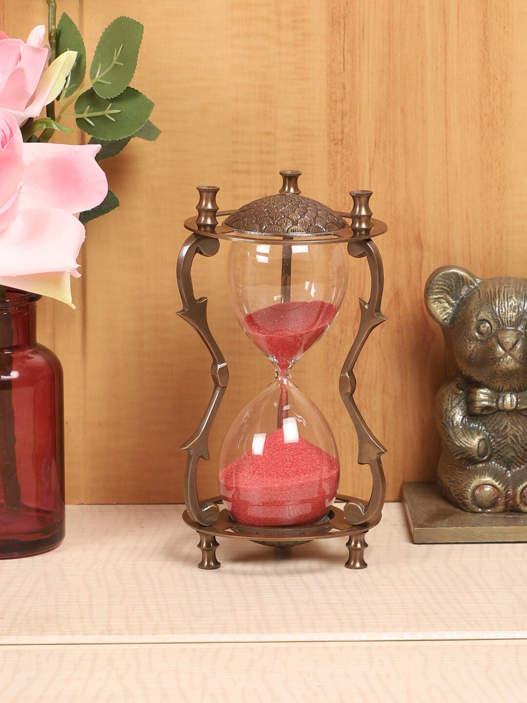 EXIM DECOR Copper-Toned & Pink Carving Antique Sand Hourglass Price in India