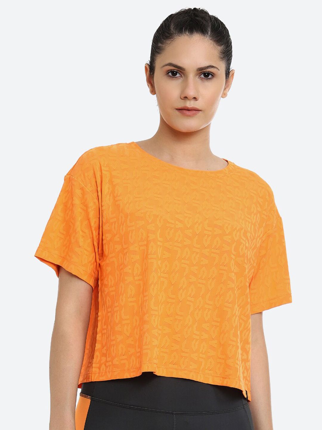 ASICS Women Orange Self Design W CROPPED LOGO JACQUARD SS Cotton Top Price in India