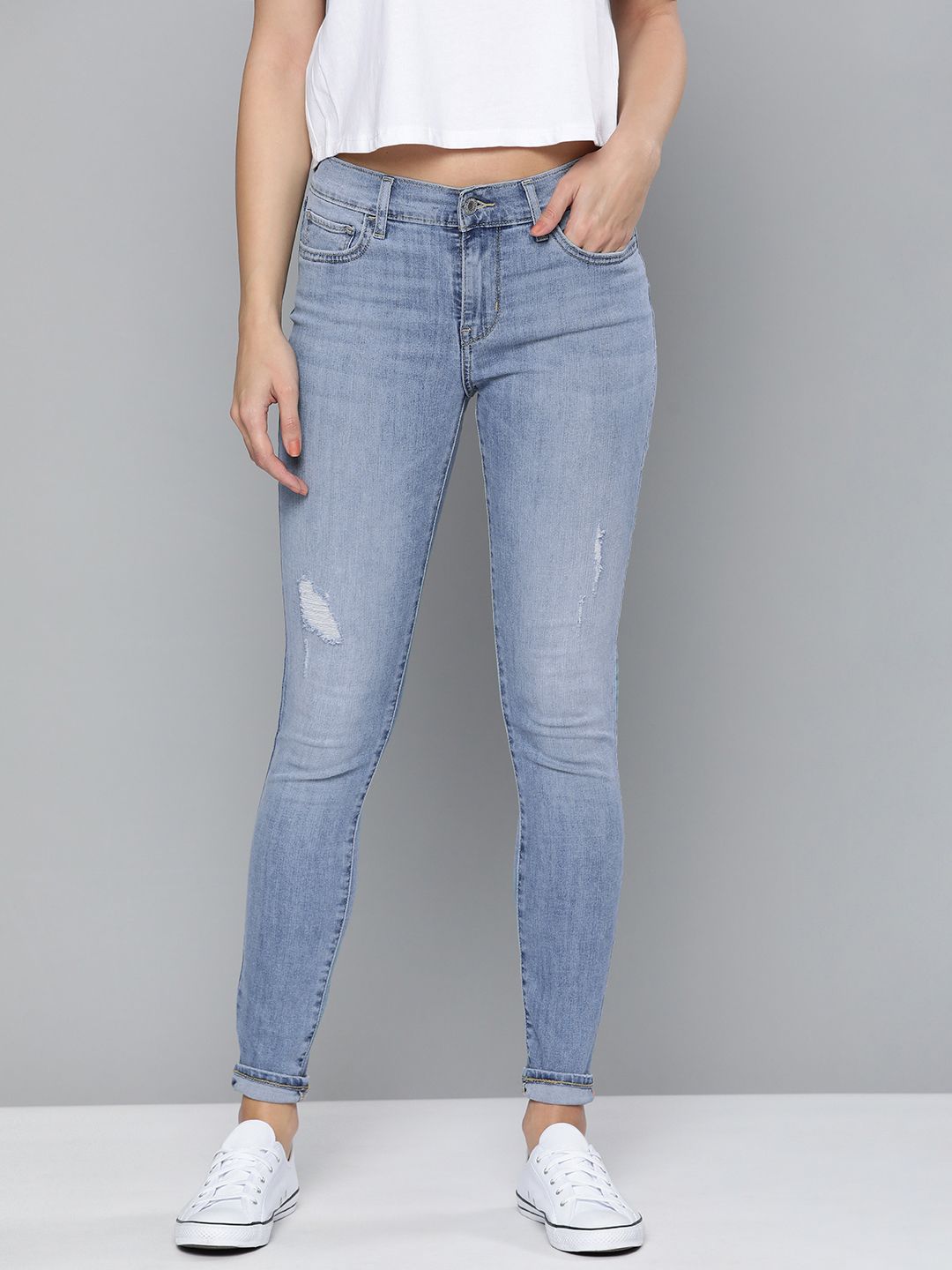 Levis Women Blue 710 Super Skinny Mildly Distressed Mid-Rise Heavy Fade Stretchable Jeans Price in India