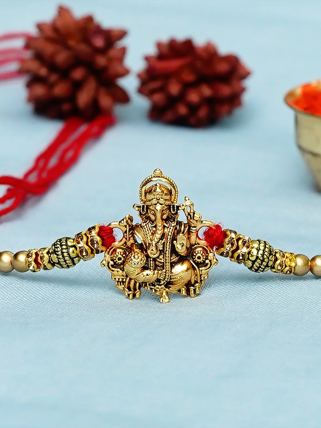 eCraftIndia Gold-Toned & Red Designer Ganesha Rakhi
