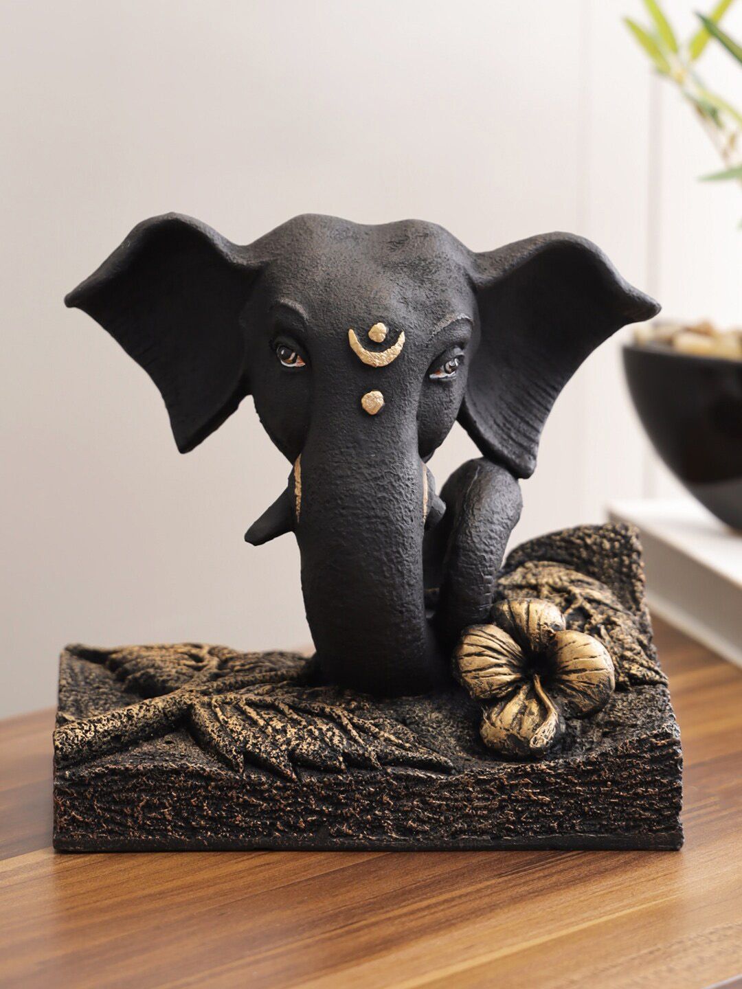 HomeTown Black & Gold-Toned Eternal Polyresin Flower Base Ganesha Figurine Showpiece Price in India
