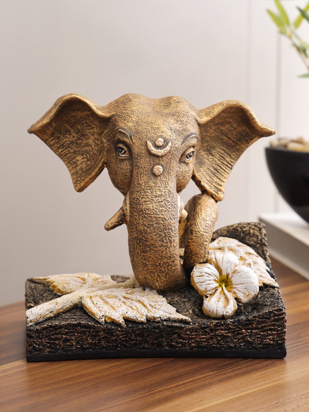 HomeTown Gold-Toned & White Eternal Polyresin Flower Base Ganesha Figurine Showpiece Price in India