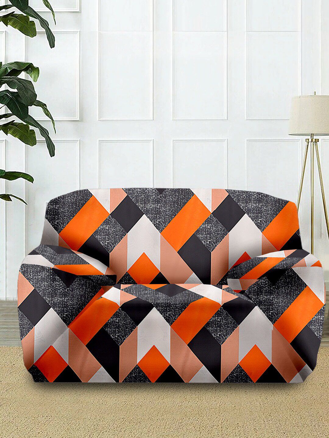 Cortina Orange & Black Geometric Printed 1-Seater Super-Stretchable Non-Slip Sofa Slipcover Price in India