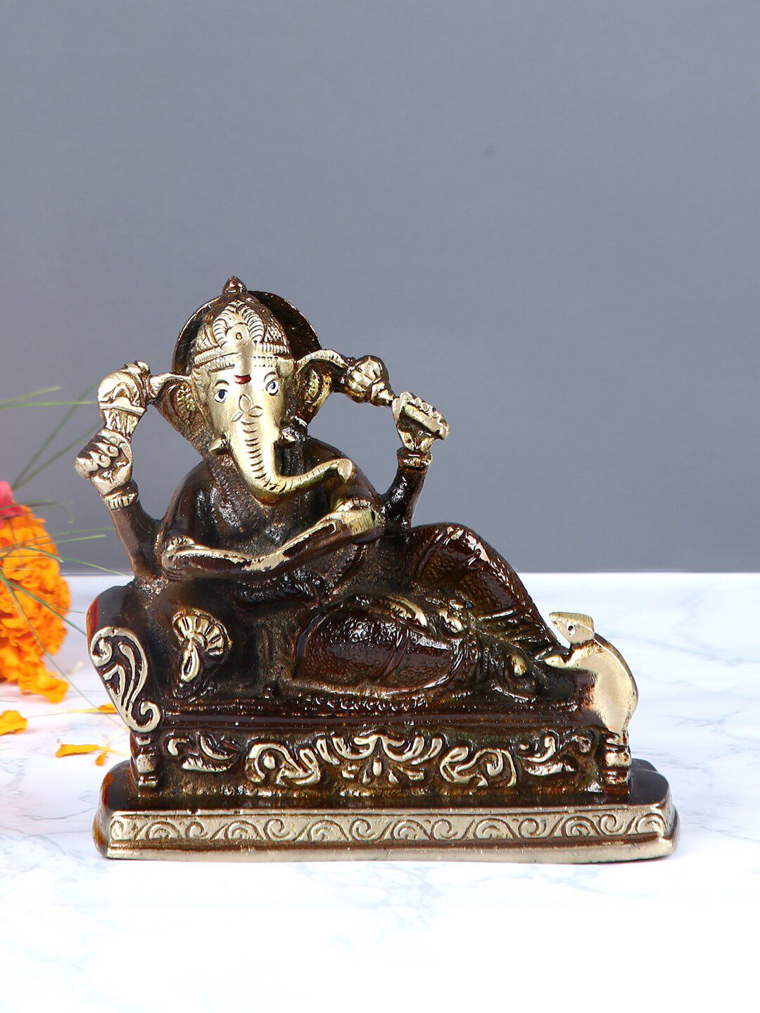 Aapno Rajasthan Brown & Gold-Toned Lord Ganesha Reading A Book Showpiece Price in India