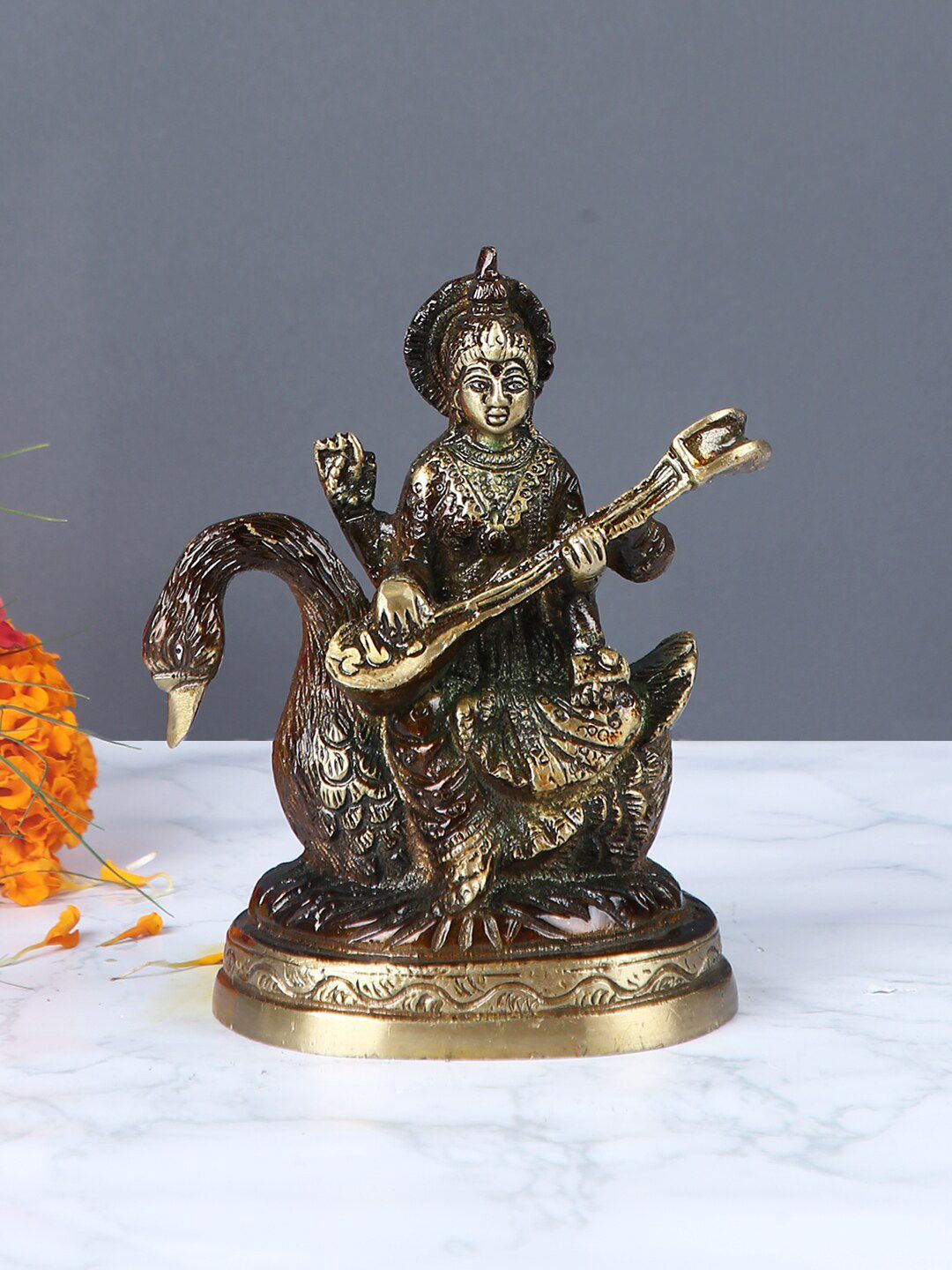 Aapno Rajasthan Brown & Gold-Toned Handcrafted Goddess Saraswati Brass Statue Price in India