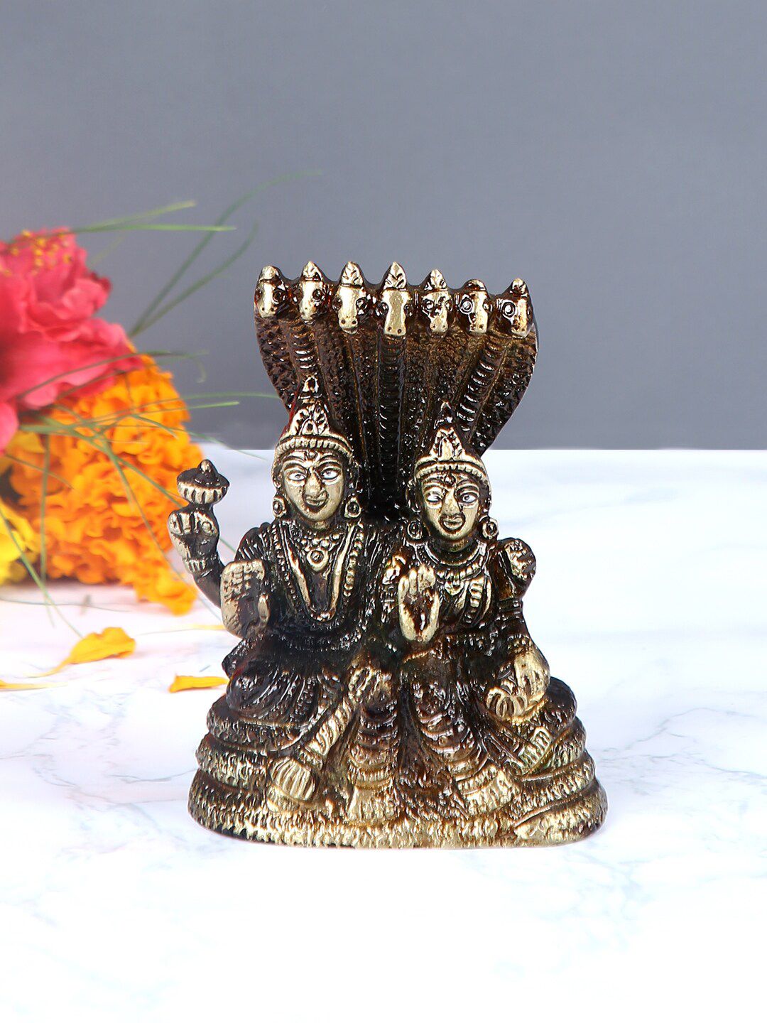 Aapno Rajasthan Gold-Toned & Brown Handcrafted Lord Vishnu & Goddess Laxmi Showpiece Price in India