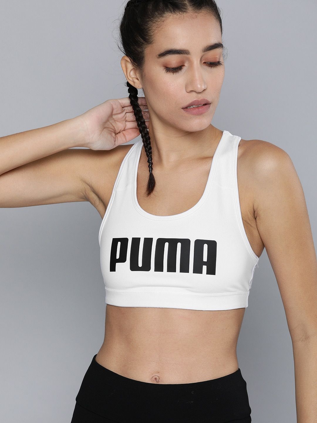 Puma Women White & Black Brand Logo Print Mid Impact 4Keeps Sustainable Training Bra Price in India