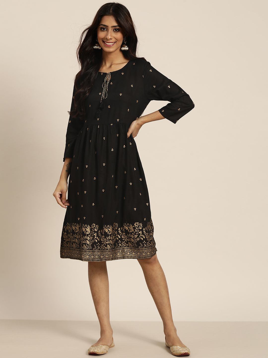 Sangria Women Black & Golden Tie-Up Neck Ethnic Motifs Print A-Line Dress Price in India