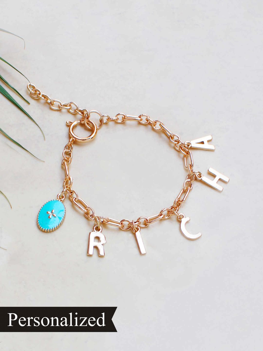 Runway Ritual Women Gold-Plated & Turquoise Blue Customizable Name Charm Bracelet Price in India
