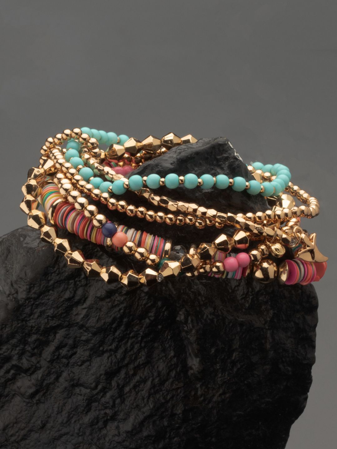 AMI Women Gold-Toned & Pink Gold-Plated Elasticated Bracelet Price in India