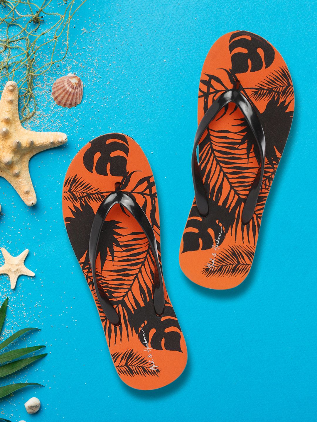 Mast & Harbour Women Black & Orange Printed Thong Flip-Flops Price in India