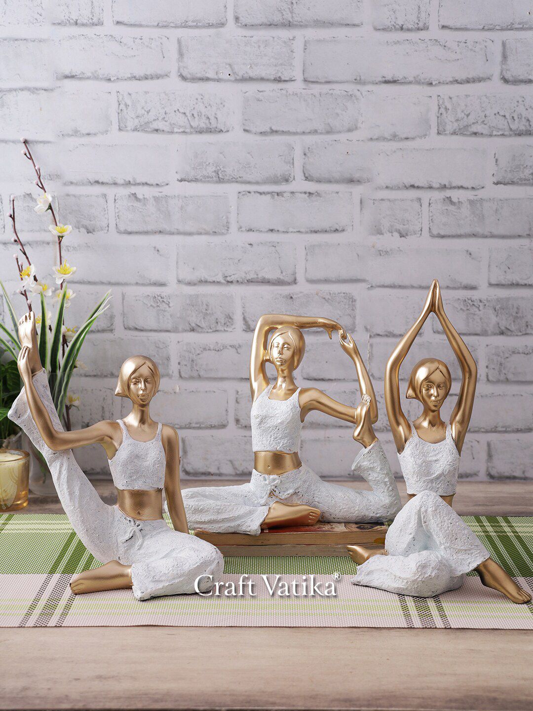 CraftVatika White & Gold-Toned Yoga Posture Lady Statue Showpieces Price in India