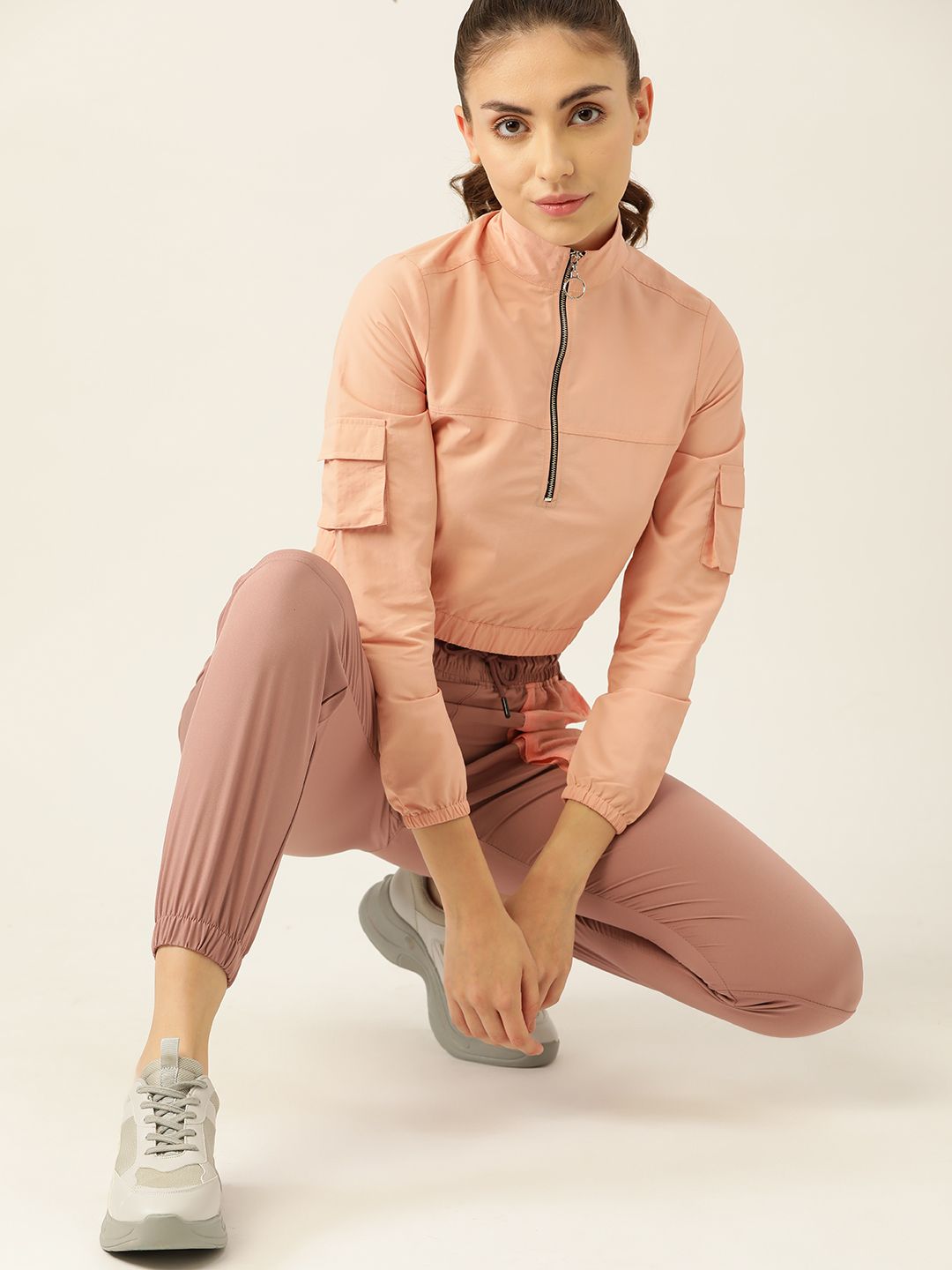 DressBerry Women Peach-Coloured Solid Crop Sweatshirt Price in India