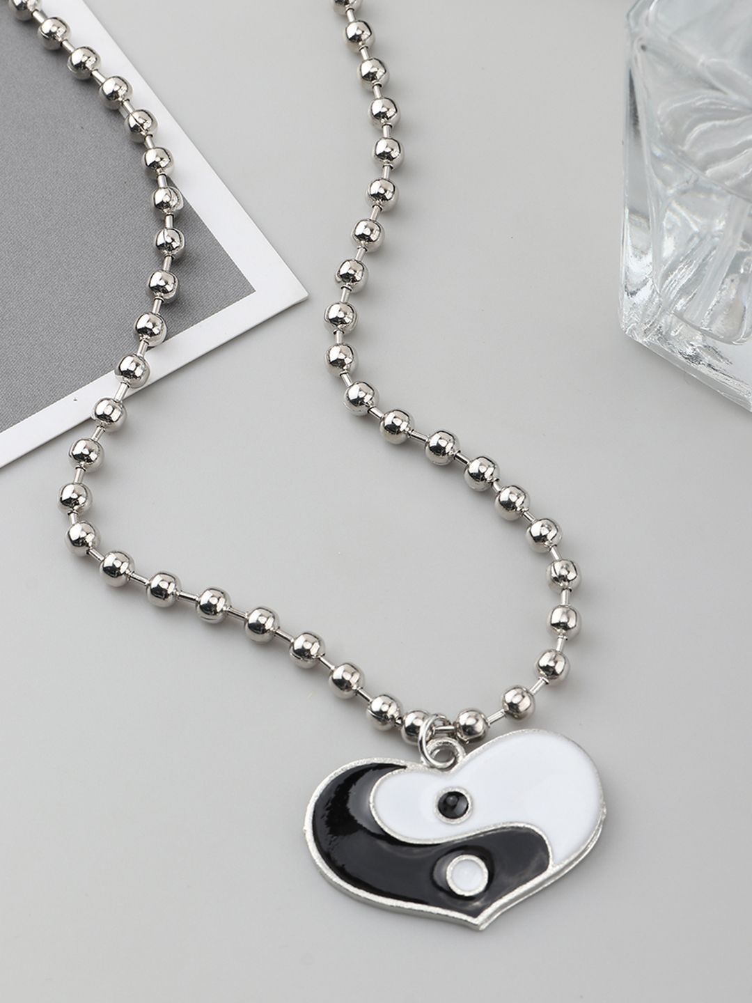 URBANIC Silver-Toned & Black Yin Yang Enamelled Heart-Shaped Necklace Price in India