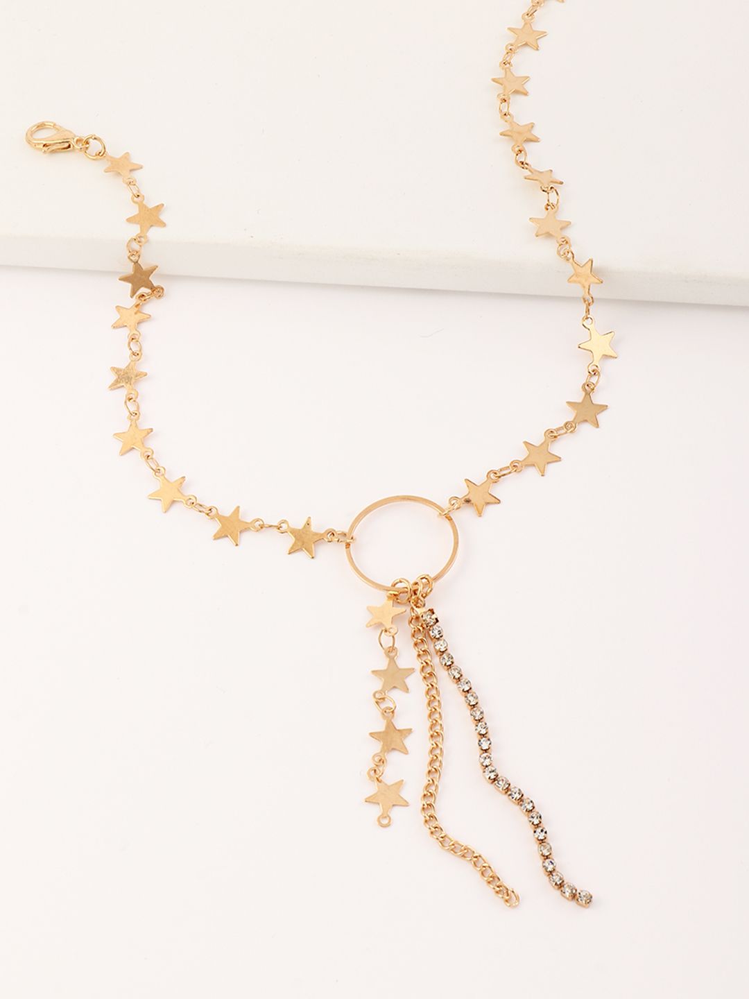 URBANIC Gold-Toned Stone Studded Star Textured Tasselled Necklace Price in India