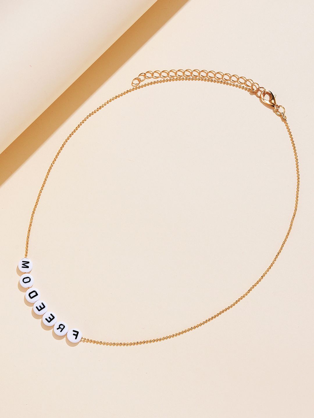 URBANIC Gold-Toned & White Alphabet Beaded Necklace Price in India