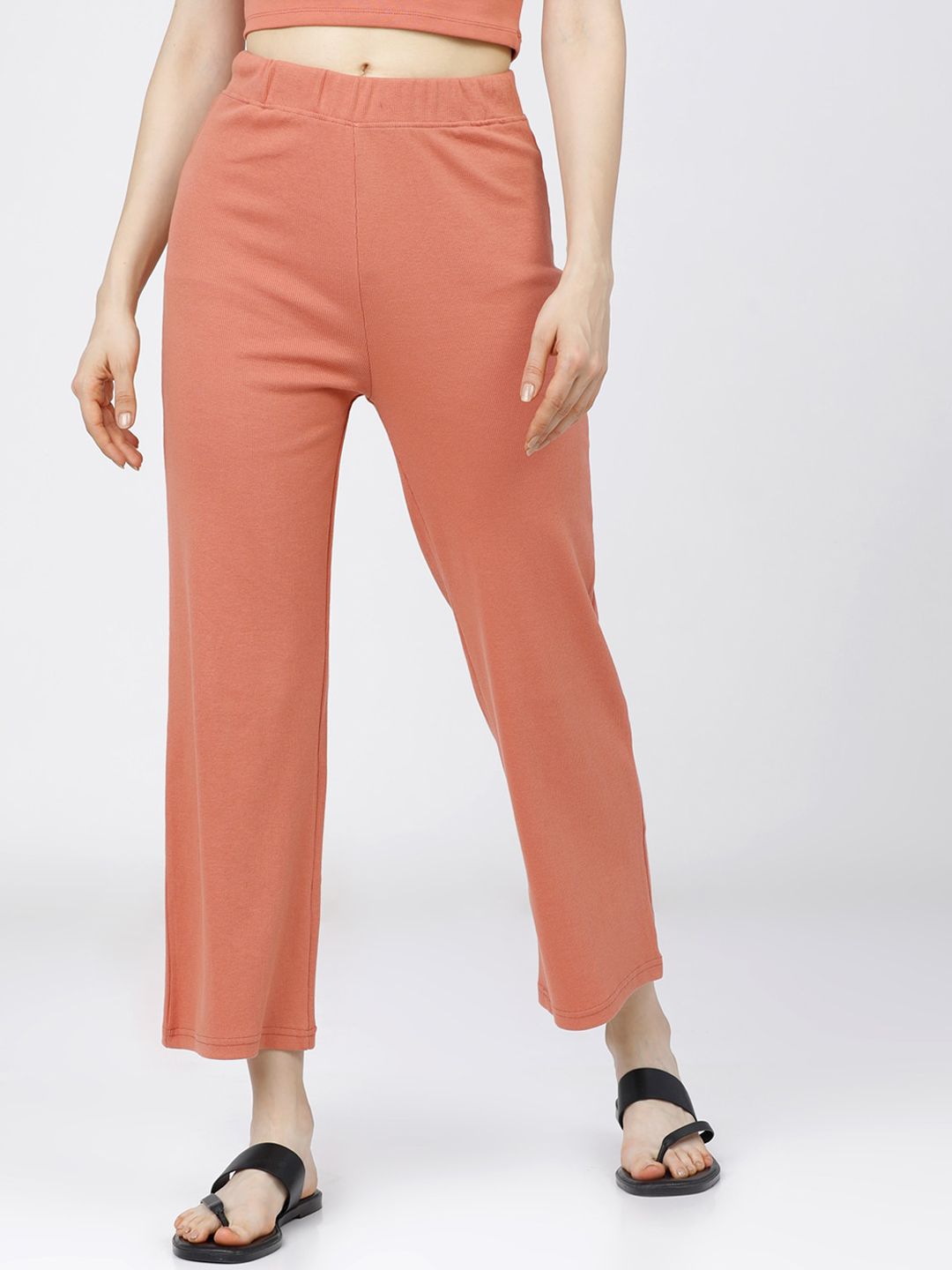 Tokyo Talkies Women Orange Trousers Price in India