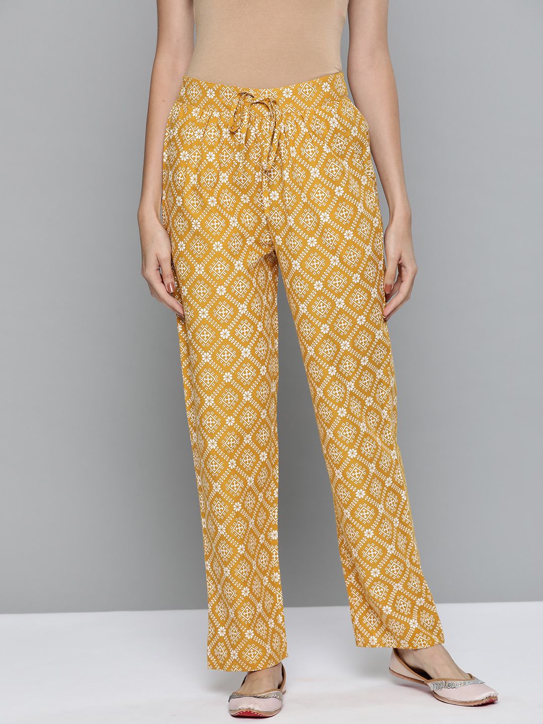 HERE&NOW Women Mustard Yellow & White Ethnic Motifs Printed Pure Cotton Trousers Price in India