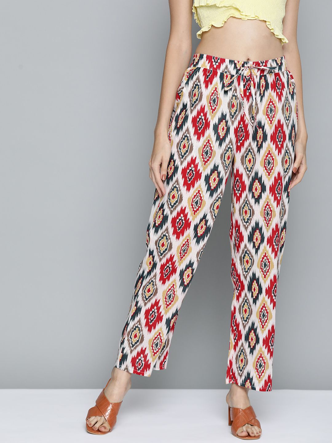 HERE&NOW Women Red & Green Pure Cotton Ikkat Print High-Rise Trousers Price in India