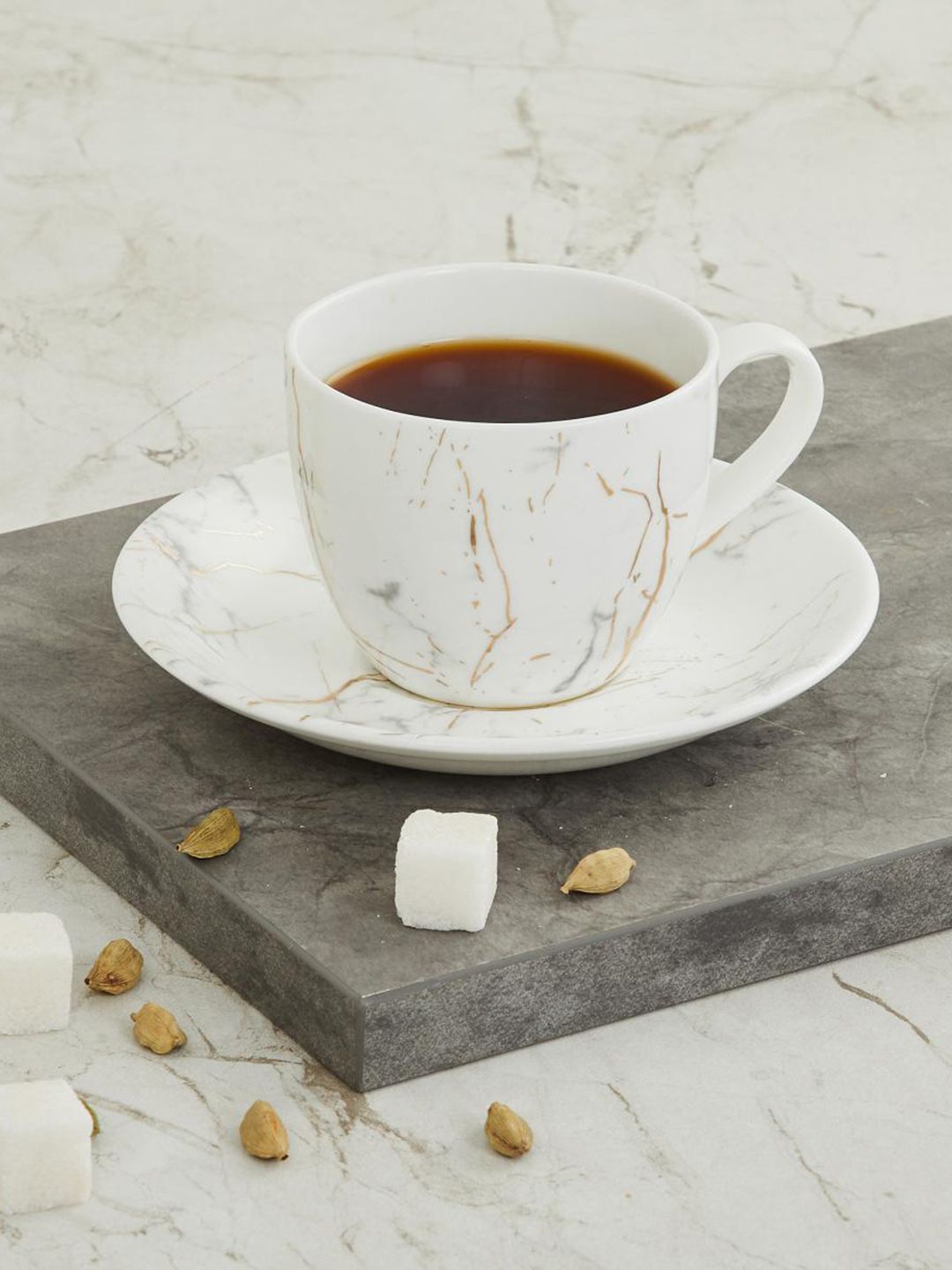 Home Centre White Printed Marble Patterned Cup and Saucer Set Price in India
