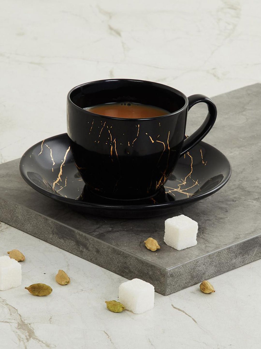 Home Centre Black Printed Marble Printed Cup and Saucer Set Price in India