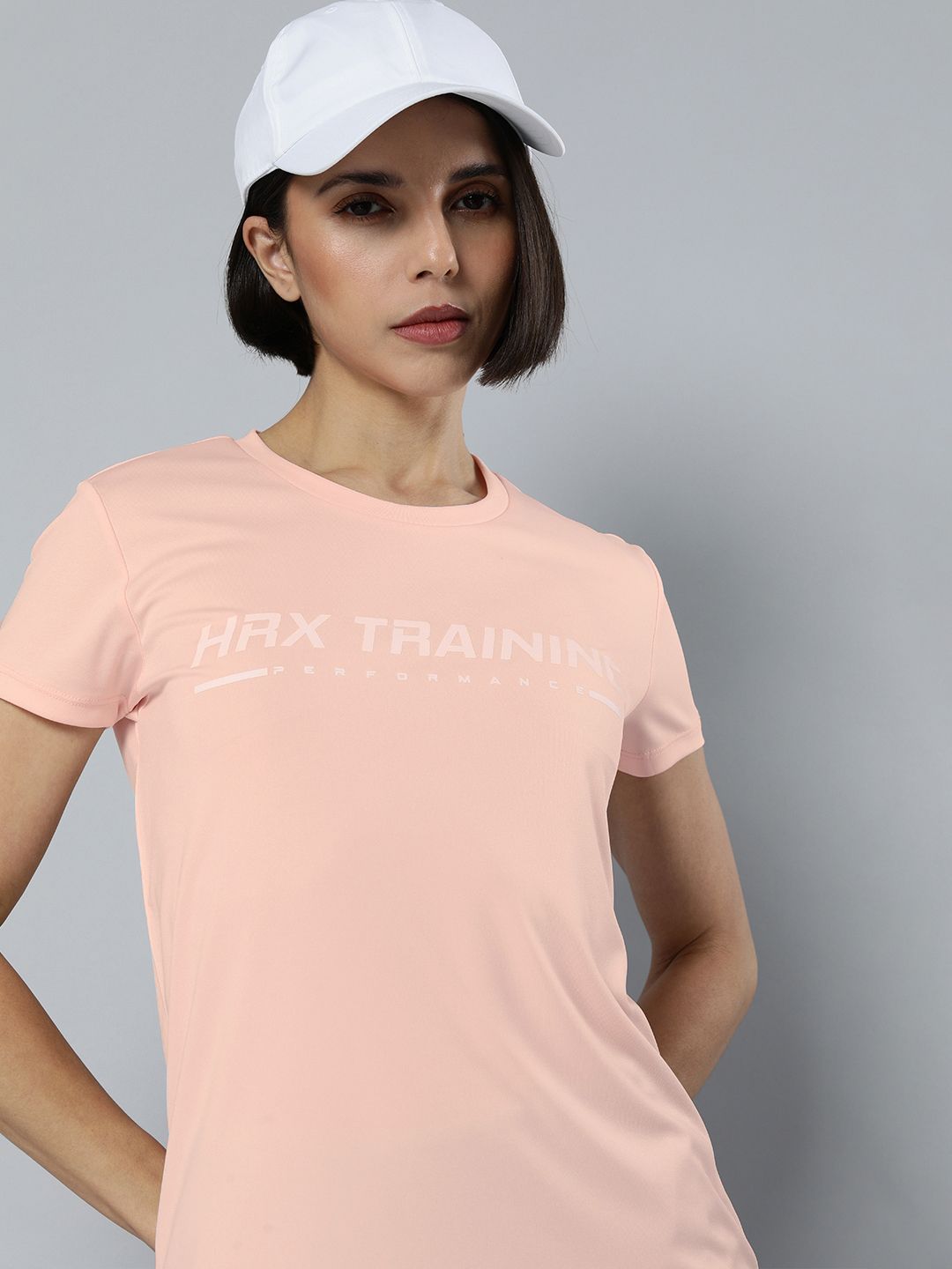 HRX By Hrithik Roshan Women Peach-Coloured Rapid-Dry Brand Carrier Training T-shirt Price in India