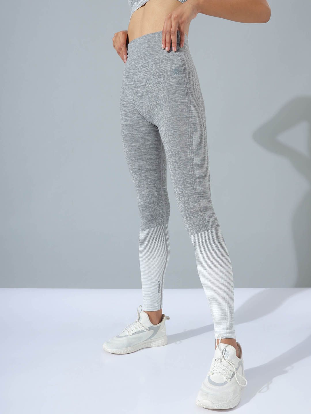 Cultsport Women Grey Melange & White Colourblocked Seamless Form Sports Leggings Price in India