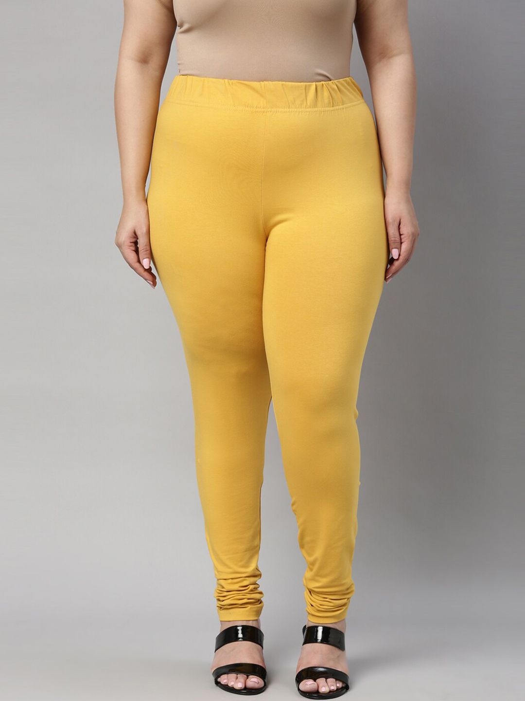 Go Colors Women Yellow Solid Cotton Churidar-Length Leggings Price in India