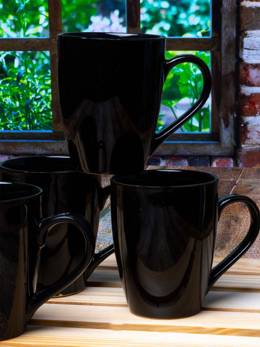 Roxx Set of 4 Black Solid Ceramic Glossy Coffee Mugs Price in India