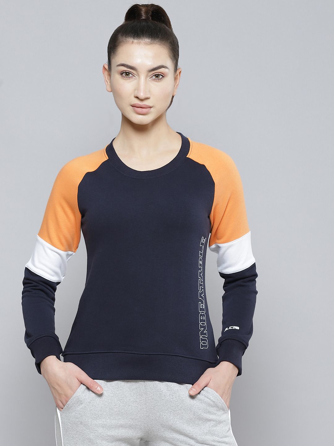 Alcis Women Navy Blue & Orange Colourblocked Cotton Sweatshirt with Side Applique Prints Price in India