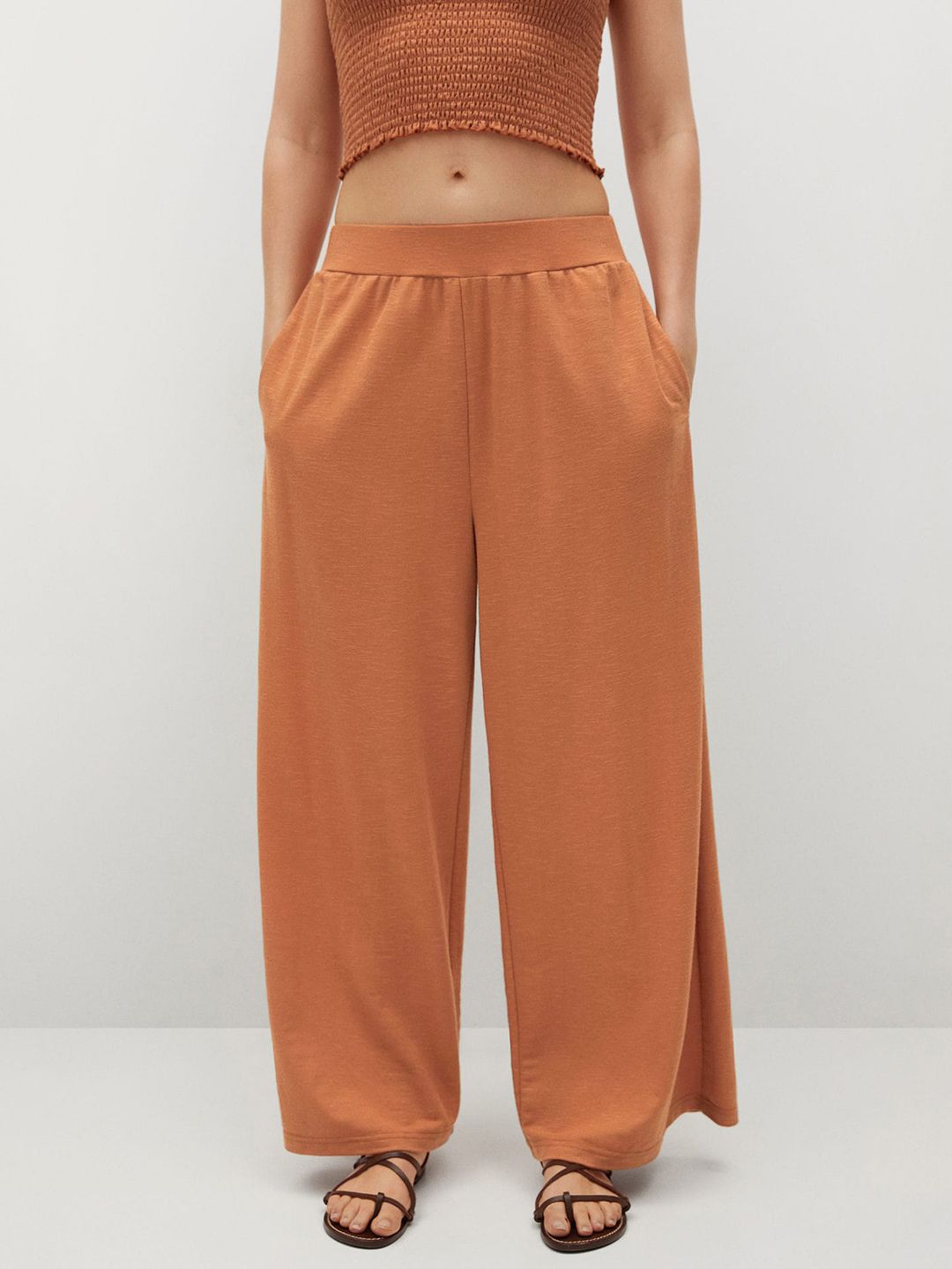 MANGO Women Rust Orange Solid Parallel Trousers Price in India