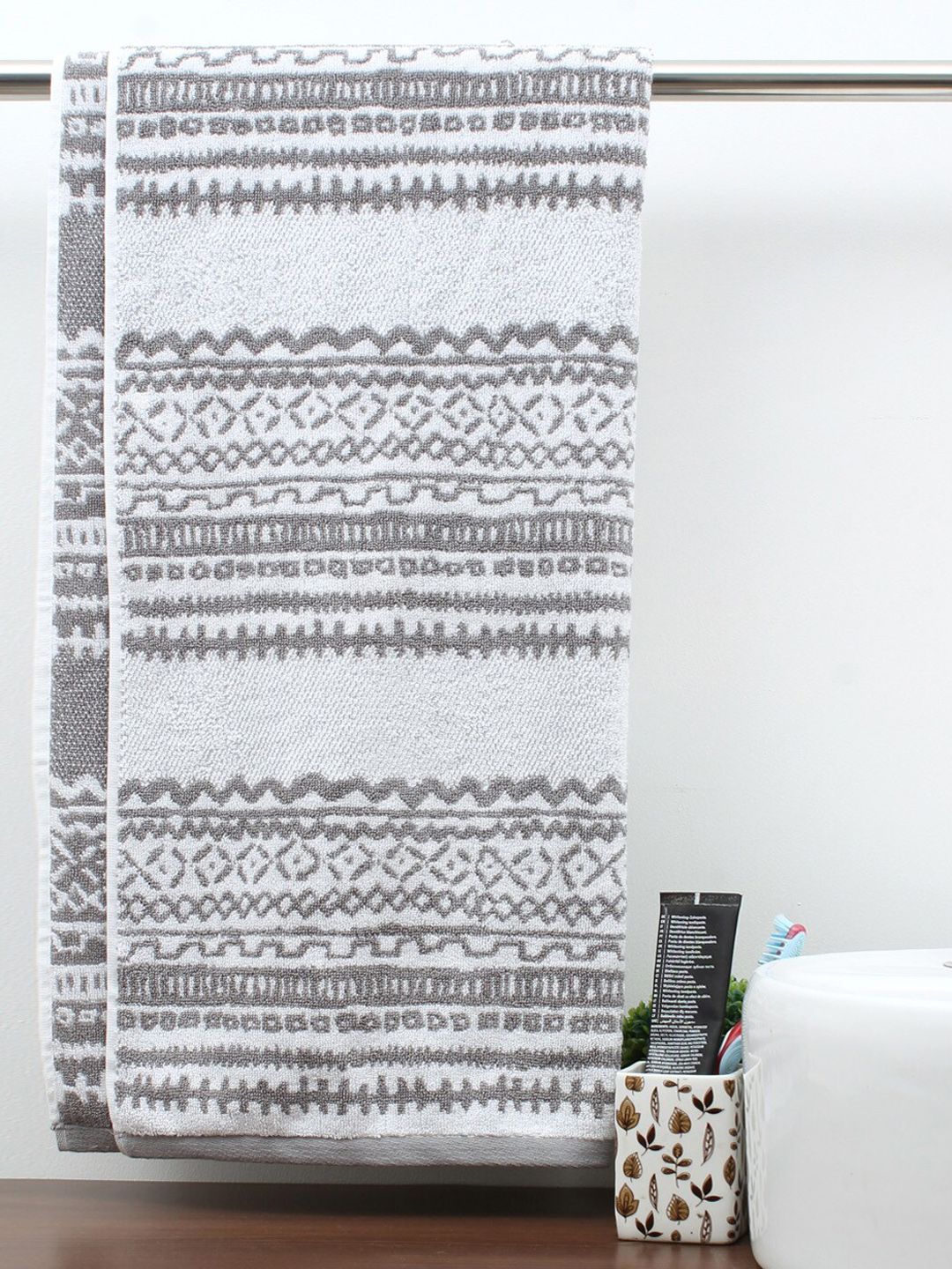 AVI Living White & Grey Printed 600 GSM Pure Cotton Fossil Bath Towel Price in India