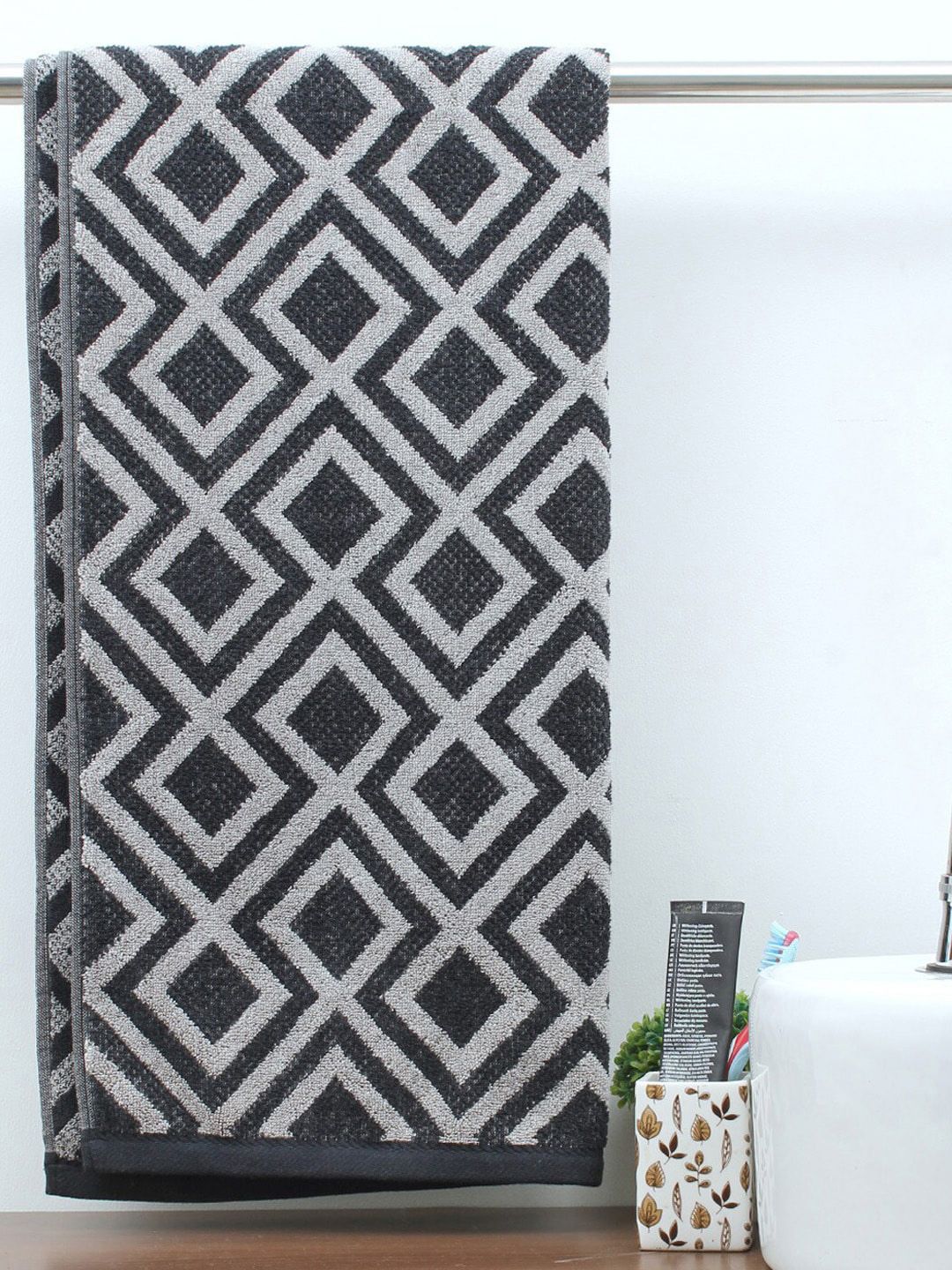 AVI Living Black & Grey Printed 550 GSM Pure Cotton Reversible Mod Bath Towel Price in India