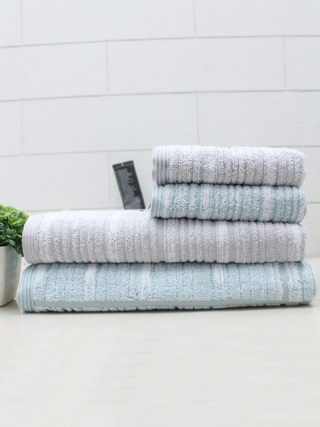 AVI Living Lavender & Blue Set of 4 Embossed Striped 600 GSM Pure Cotton Towel Set Price in India