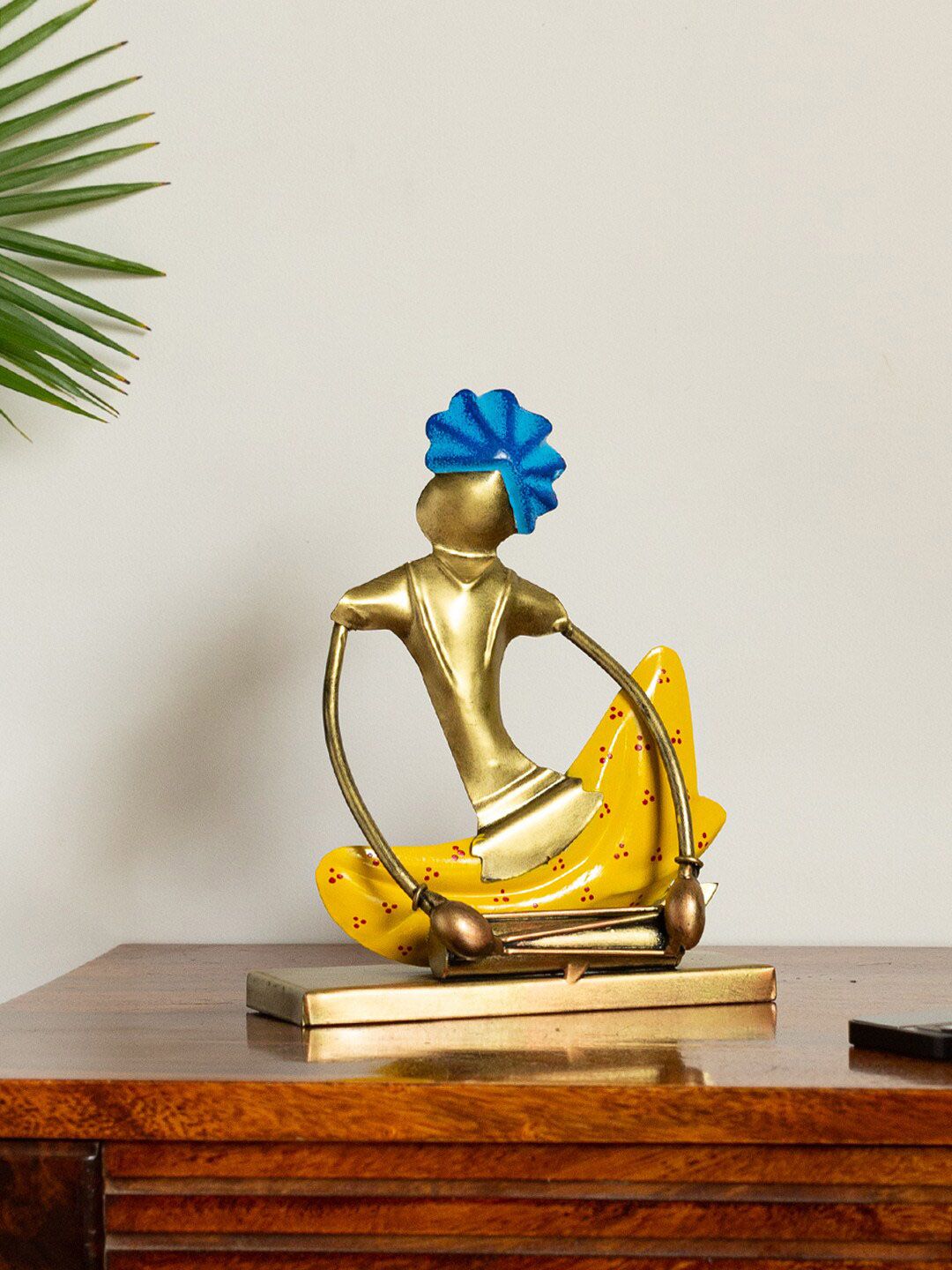 ExclusiveLane Gold-Toned & Yellow Handpainted & Handcrafted Decorative Dholakwala Folk Artist Showpiece Price in India