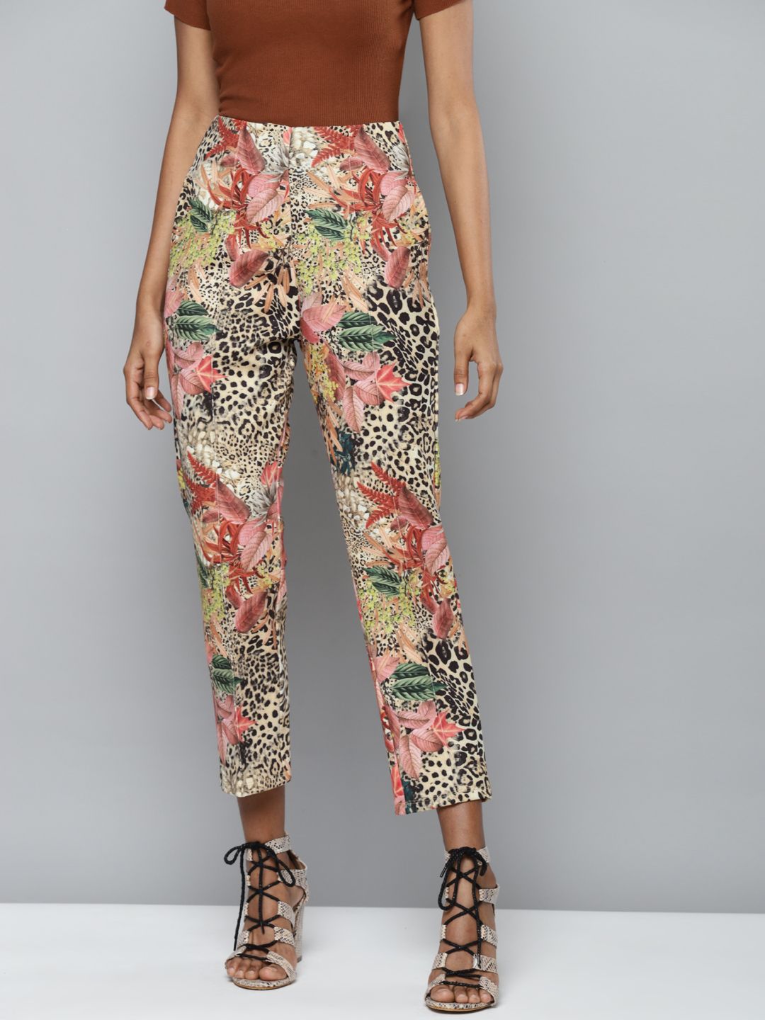 SASSAFRAS Women Beige Floral Printed Tapered Fit High-Rise Trousers Price in India
