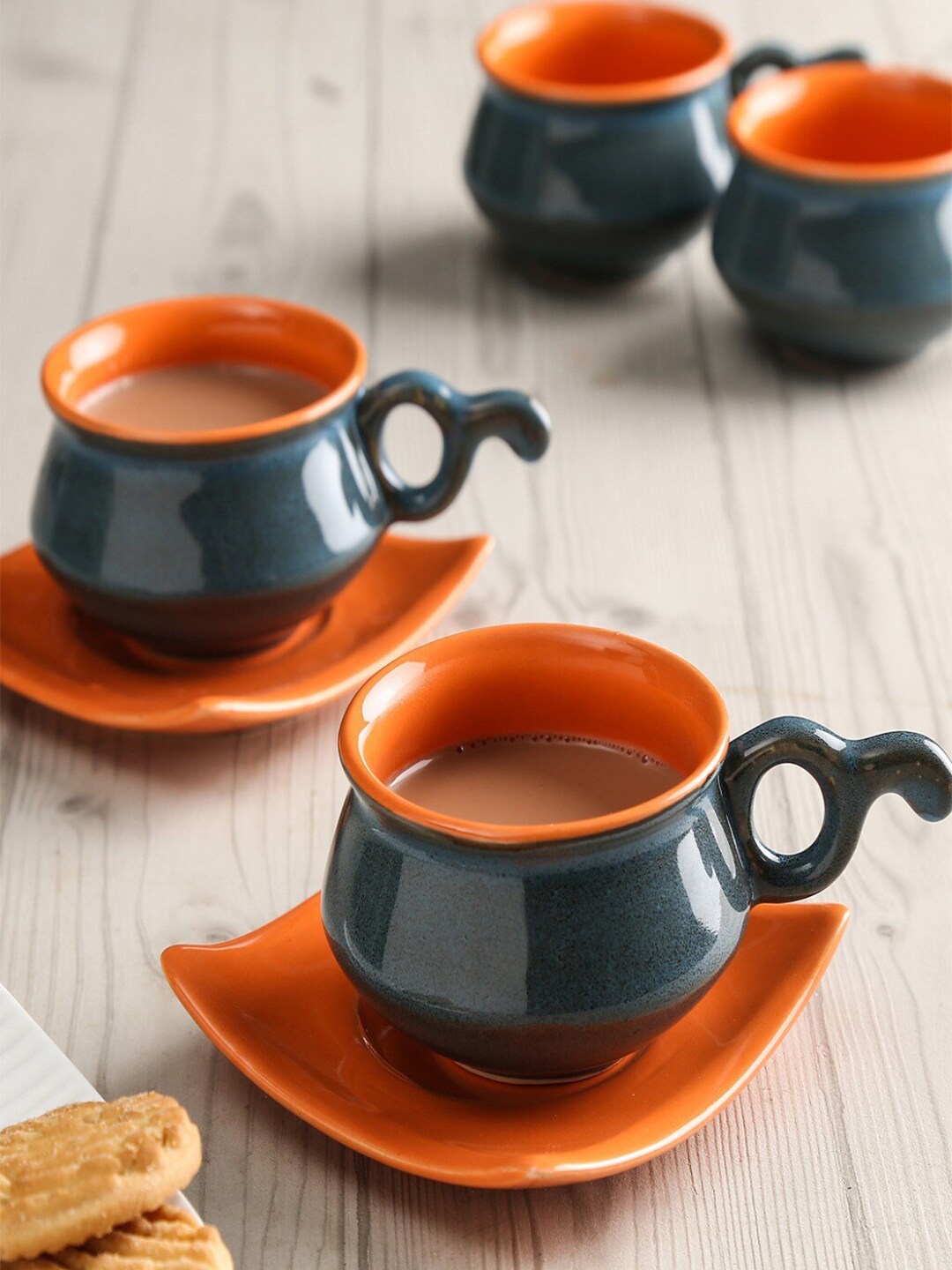 Unravel India Set of 6 Black & Orange Solid Ceramic Matte Cups and Saucers Price in India