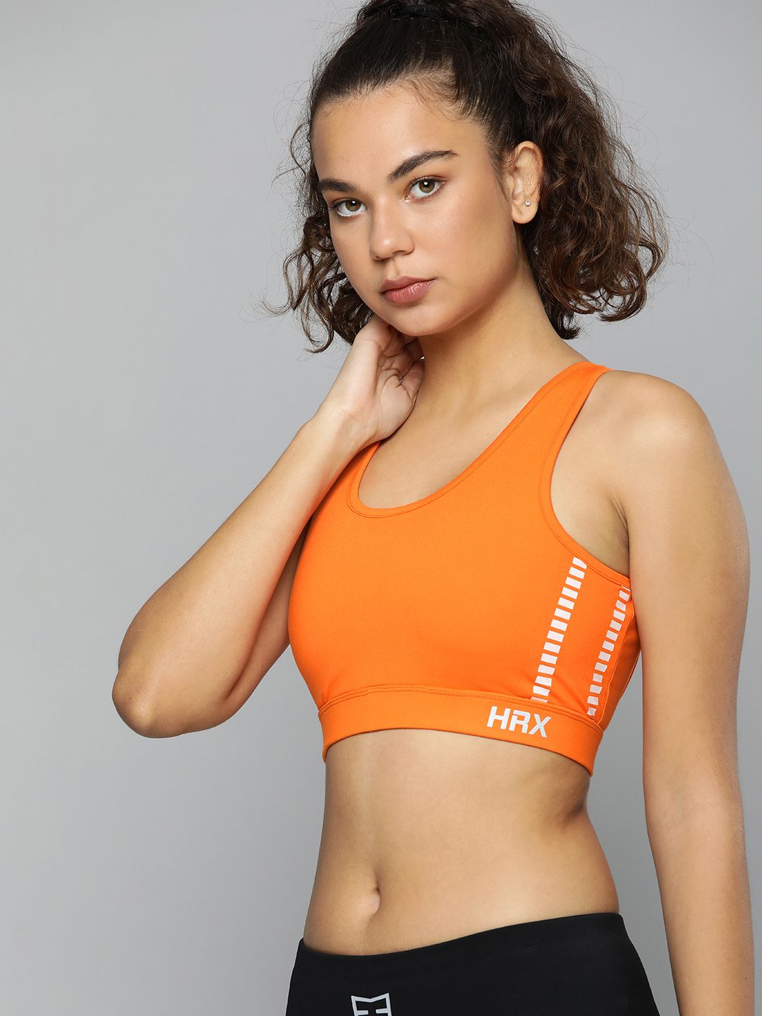 HRX By Hrithik Roshan Running Women Neon Orange Rapid-Dry Solid Sports Bra Price in India