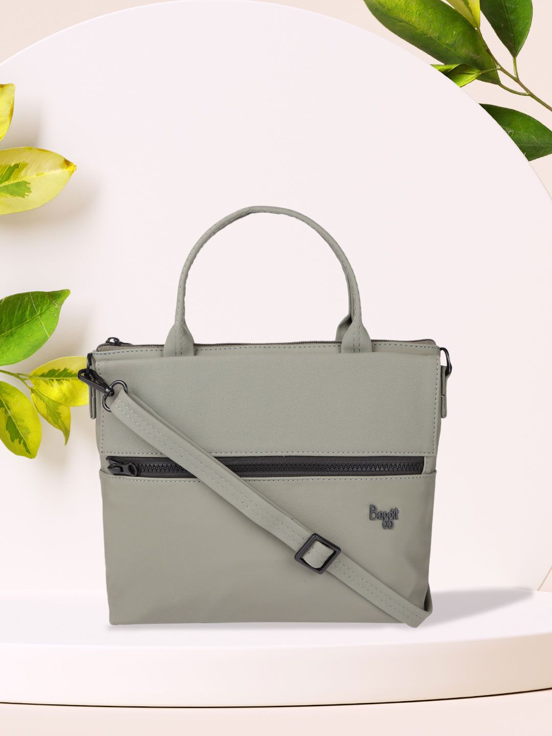 Baggit Green Solid Synthetic Leather Regular Structured Handheld Bag Price in India